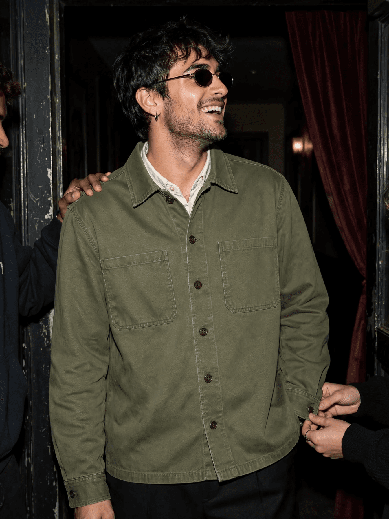 Smiling Man in Olive Overshirt example 34