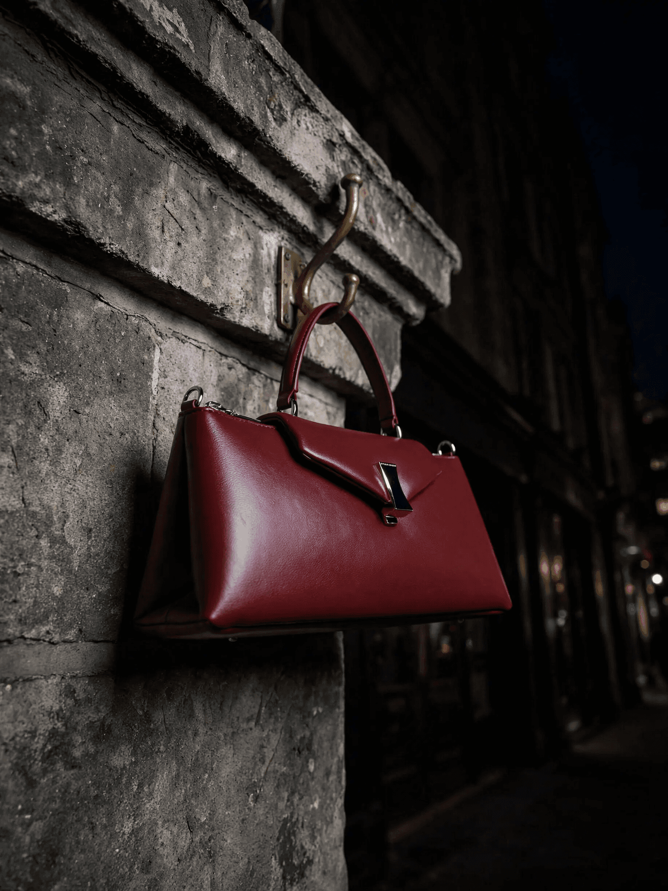 Burgundy Handbag on Stone Wall example 10