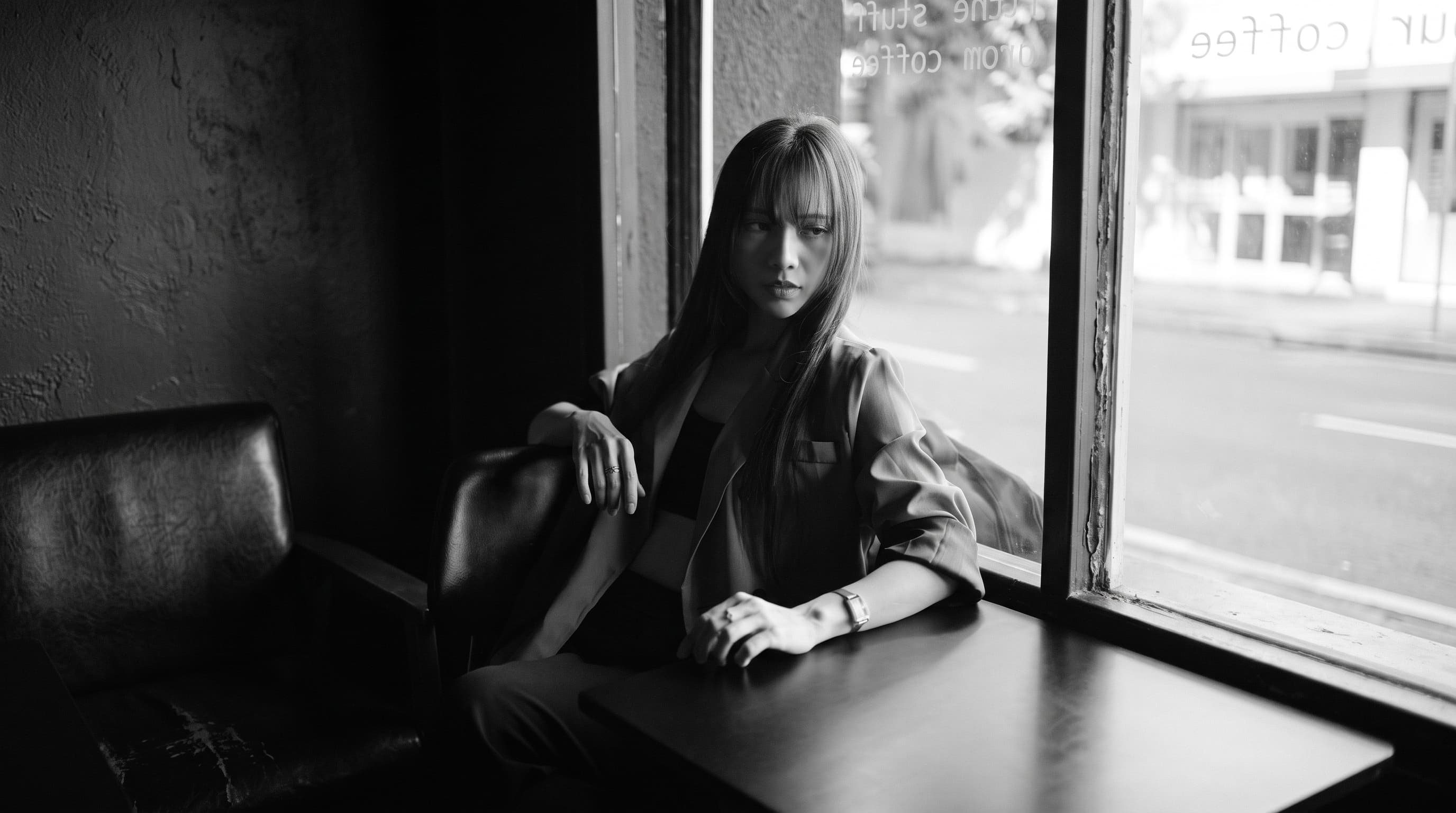 Woman Sitting by Cafe Window example 24