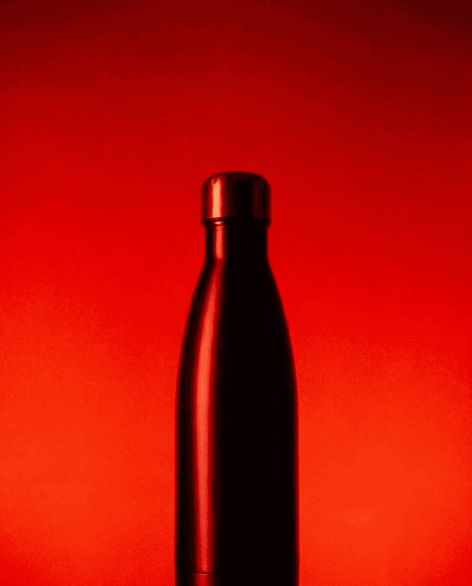 Sleek Metal Bottle on Red Backdrop example 24