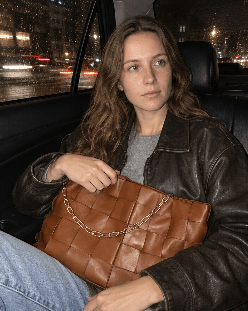 Woven Leather Handbag on Rainy Street example 8, output 2