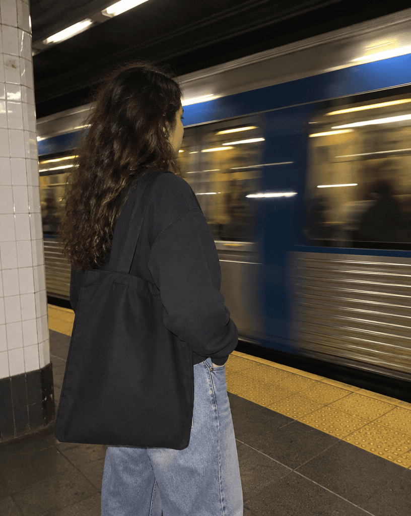 Black Tote Bag on Subway Platform example 6